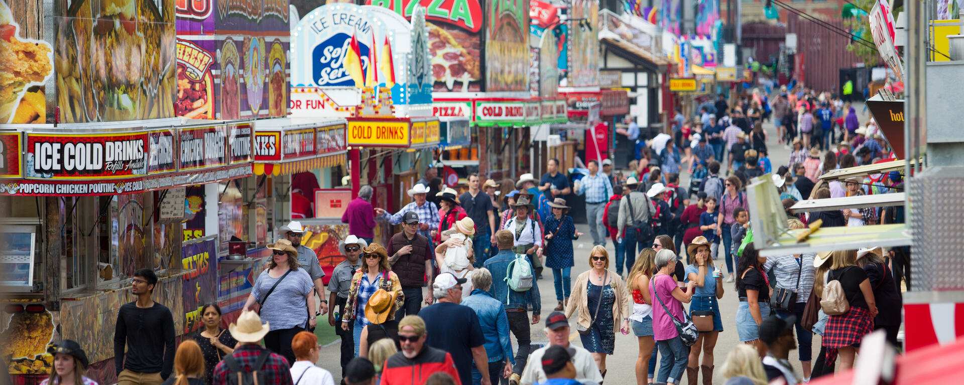 crowd walking down the midway at the Calgary Stampede