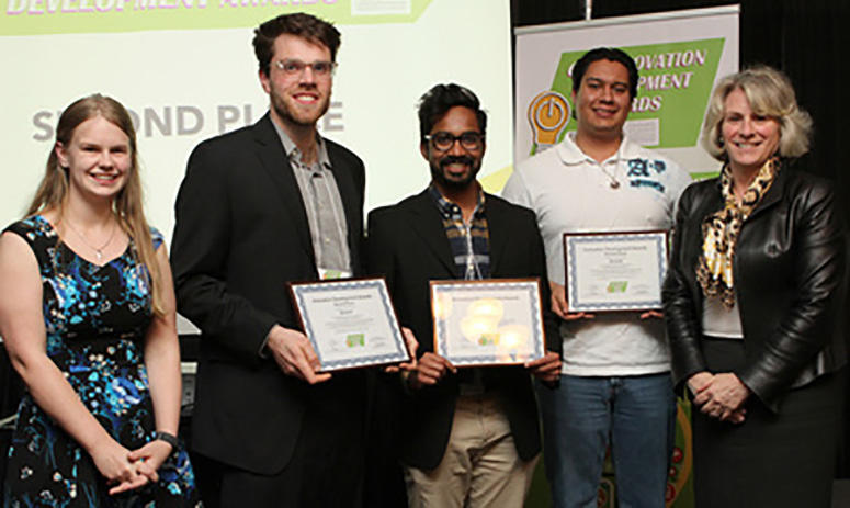 University of Calgary President Elizabeth Cannon, far right, and then-GSA President Sam Hossack, far left, present Rehable with the second-place prize at the first GSA Innovation Development Awards in 2017. Award winners were Riley Booth, Isaac Acosta and Jacob George. 