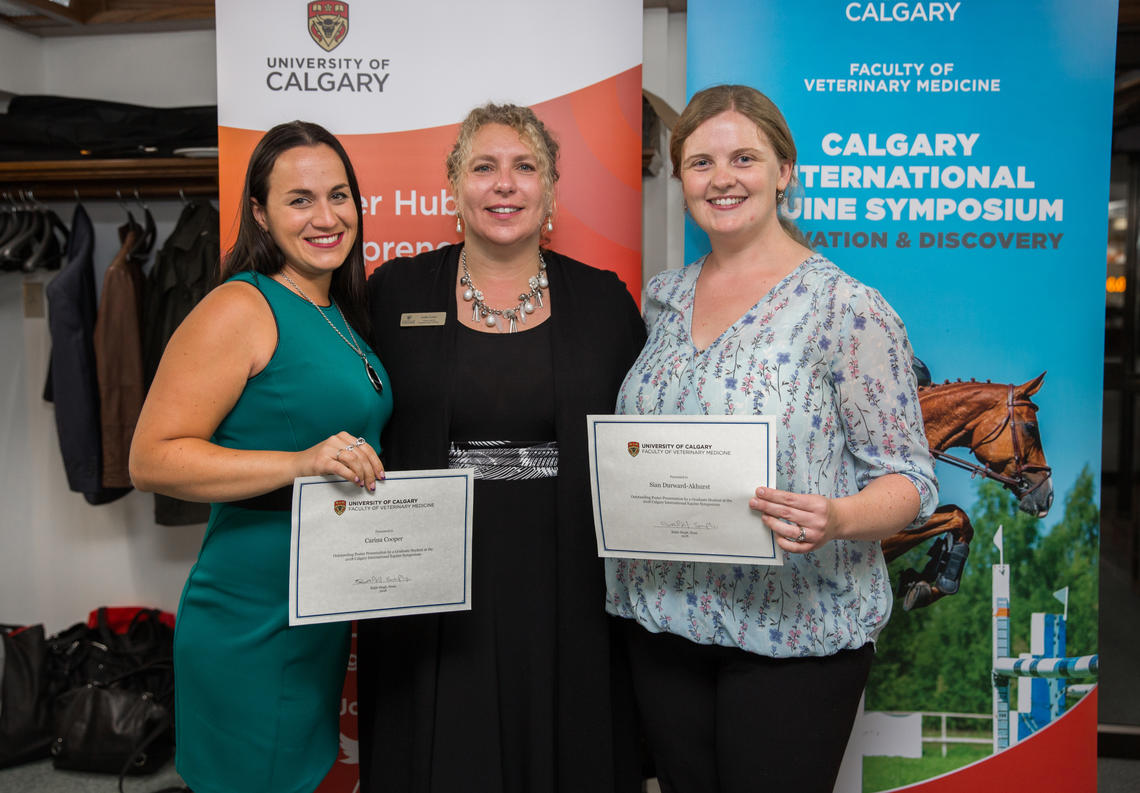 Top graduate student poster winners Carina Cooper, left, from Ontario Veterinary College, and Sian Durward-Akhurst from the University of Minnesota are congratulated by sponsor Joelle Foster, executive director of the Hunter Hub for Entrepreneurial Thinking. 