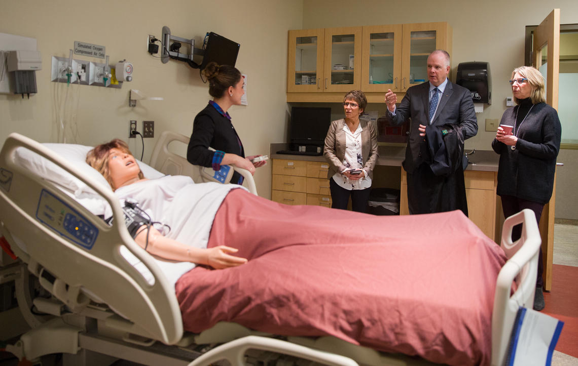 Nursing instructor Sara Ogrodnick, left, explains to police chief Chaffin how the faculty's patient simulators are used in realistic clinical scenarios to help students learn at the Faculty of Nursing's Clinical Simulation Learning Centre.