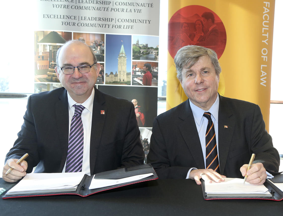 Adam Dodek, dean, Faculty of Law, University of Ottawa, left, and Ian Holloway, dean, Faculty of Law, University of Calgary, signed a Memorandum of Understanding to bring the Certification in Common Law in French to UCalgary Law.