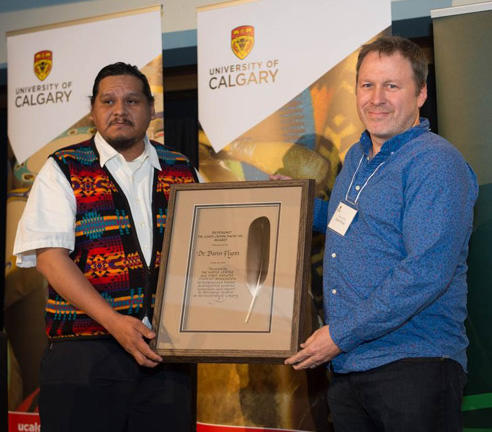 Associate professor Darin Flynn was the 2016 recipient of the Rev. Dr. Chief John Snow Sr. Award. The award was presented by Tony Snow, son of the late John Snow Sr.