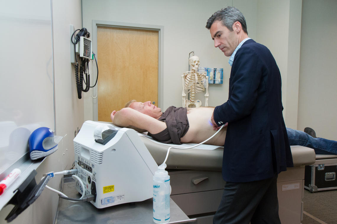 Dr. Robert Myers, a University of Calgary researcher in the Snyder Institute for Chronic Diseases and lead author of a study on the a non-invasive device called the FibroScan, examines Calgarian Kory McIntyre, 45, who has been a patient of Myers' since 2006.