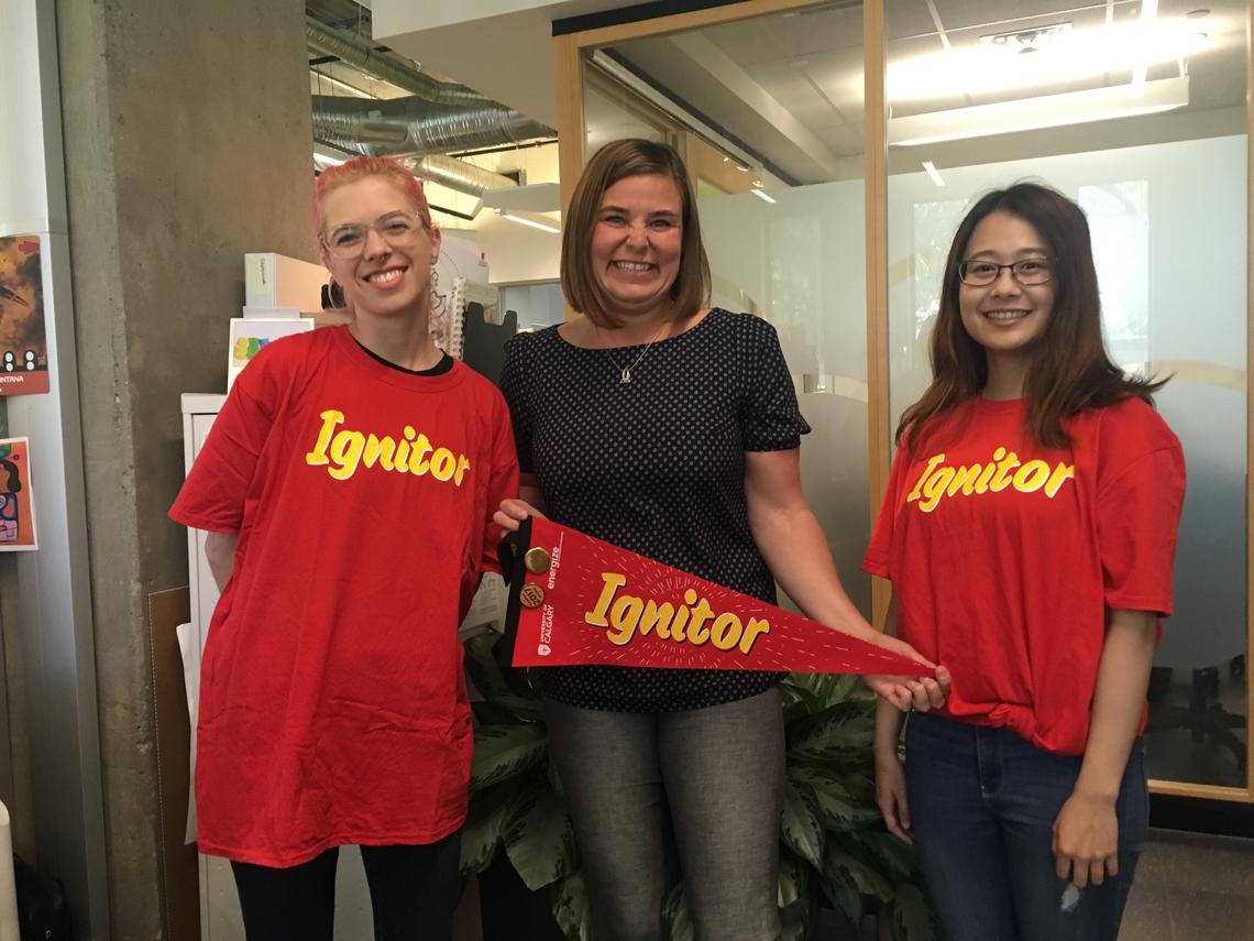 Student Calling Program students Liz Windnagel, left, and Jessie Cai, right, flank three-time Giving Day donor and proud Ignitor, Lisa Llewellyn. 