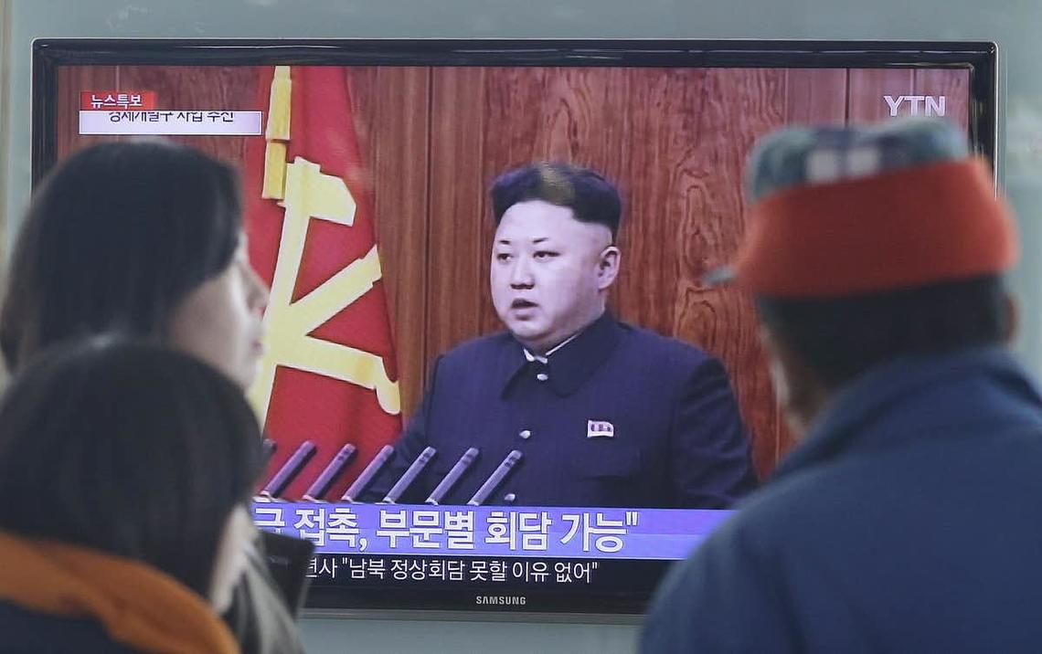 South Koreans watch North Korean leader Kim Jong-Un delivering a speech in January 2015. South Koreans have the right idea, according to research: Keep far away from strong men and dictators if you want a happy life.
