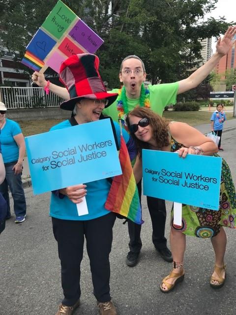 Yvonne Stanford, left, and social work prof Liza Lorenzett, right, at Pride parade with a friend.  