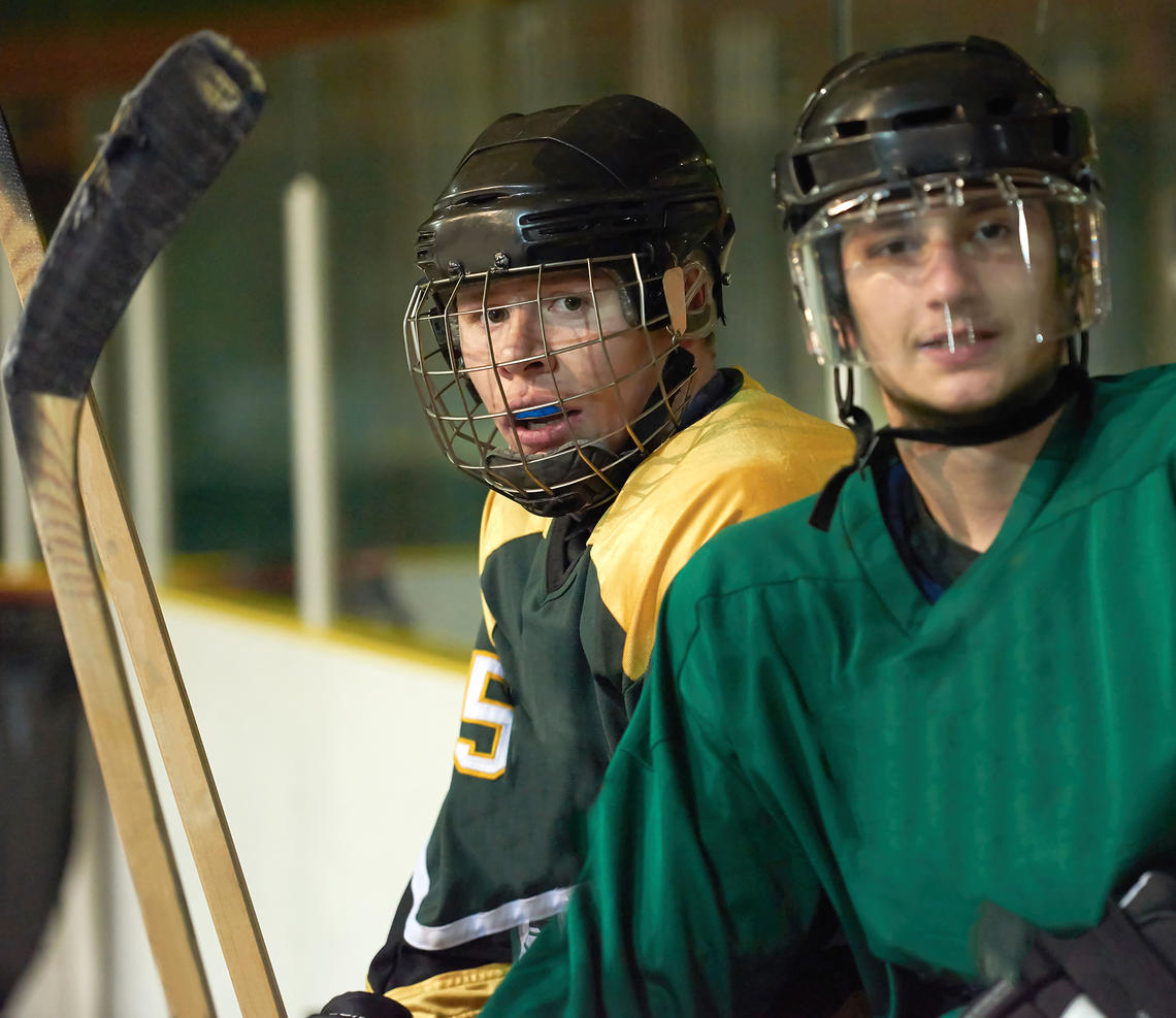 Hockey players wearing mouthguards
