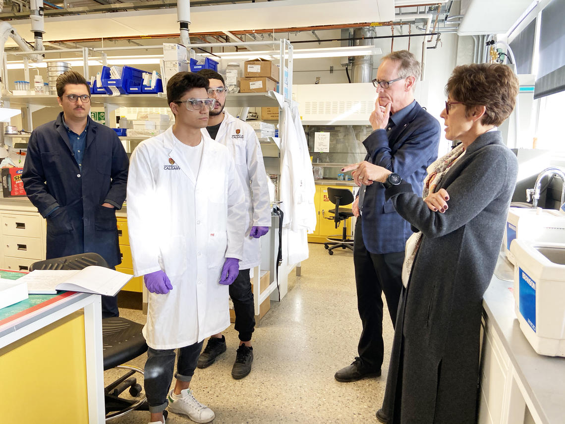 Chancellor Deborah Yedlin in the lab with chemical engineering students.