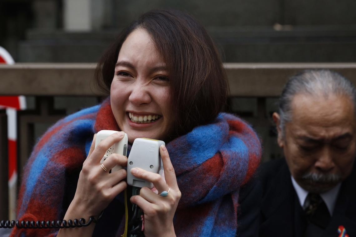 Freelance journalist Shiori Ito talks to her supporters outside a courthouse, Dec. 18, 2019, in Tokyo.