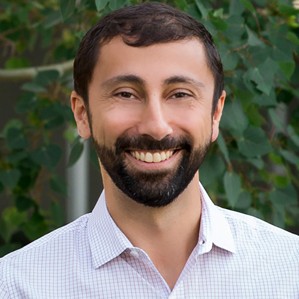 Photo of Nima Najand outside. He has a beard and is smiling