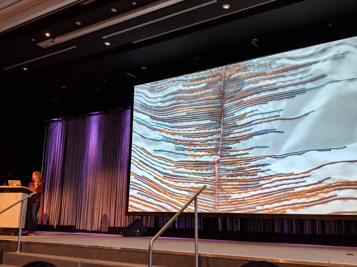 Wannamaker presenting her data embroidery at the 2018 IEEE VIS conference in Berlin