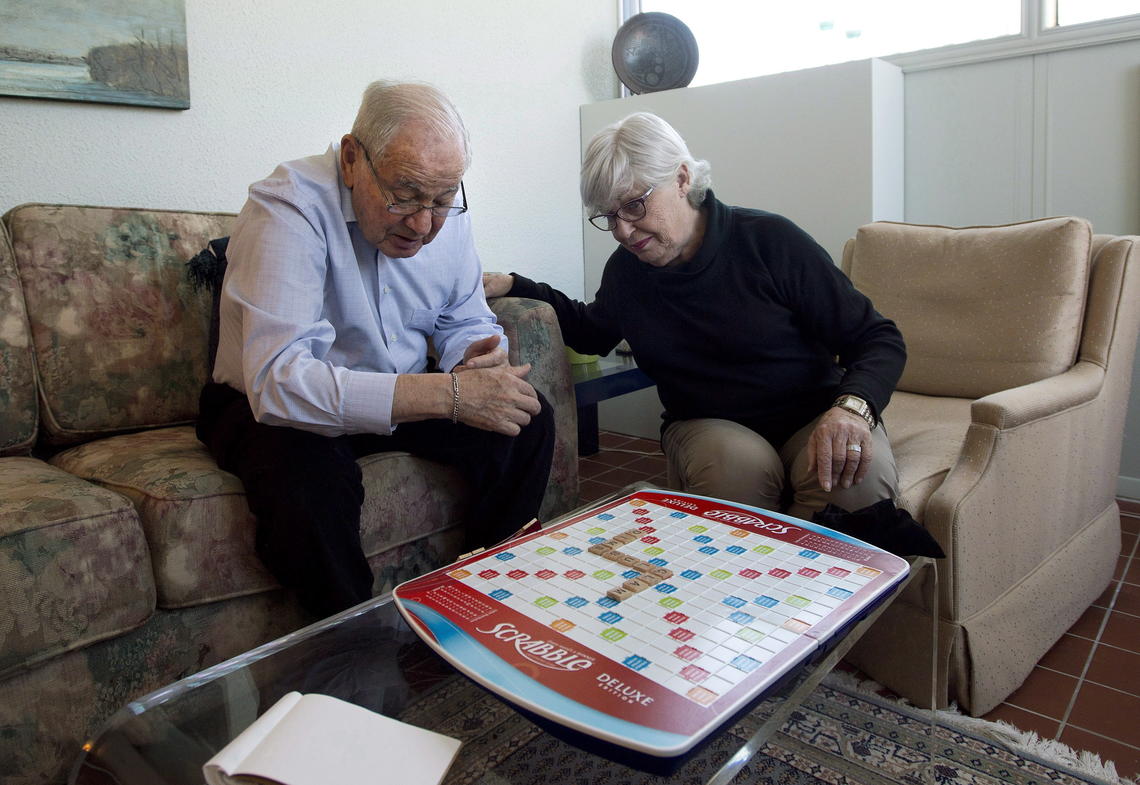 An elderly couple plays Scrabble at their Toronto home in 2013. 