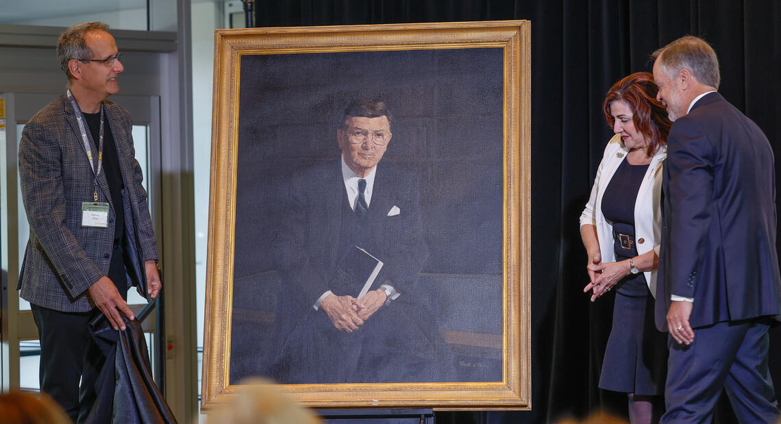 From left: Mauro Chies, Adriana LaGrange, Minister of Health for the Government of Alberta, and Lorne Jacobson unveil a portrait of Arthur J.E. Child.