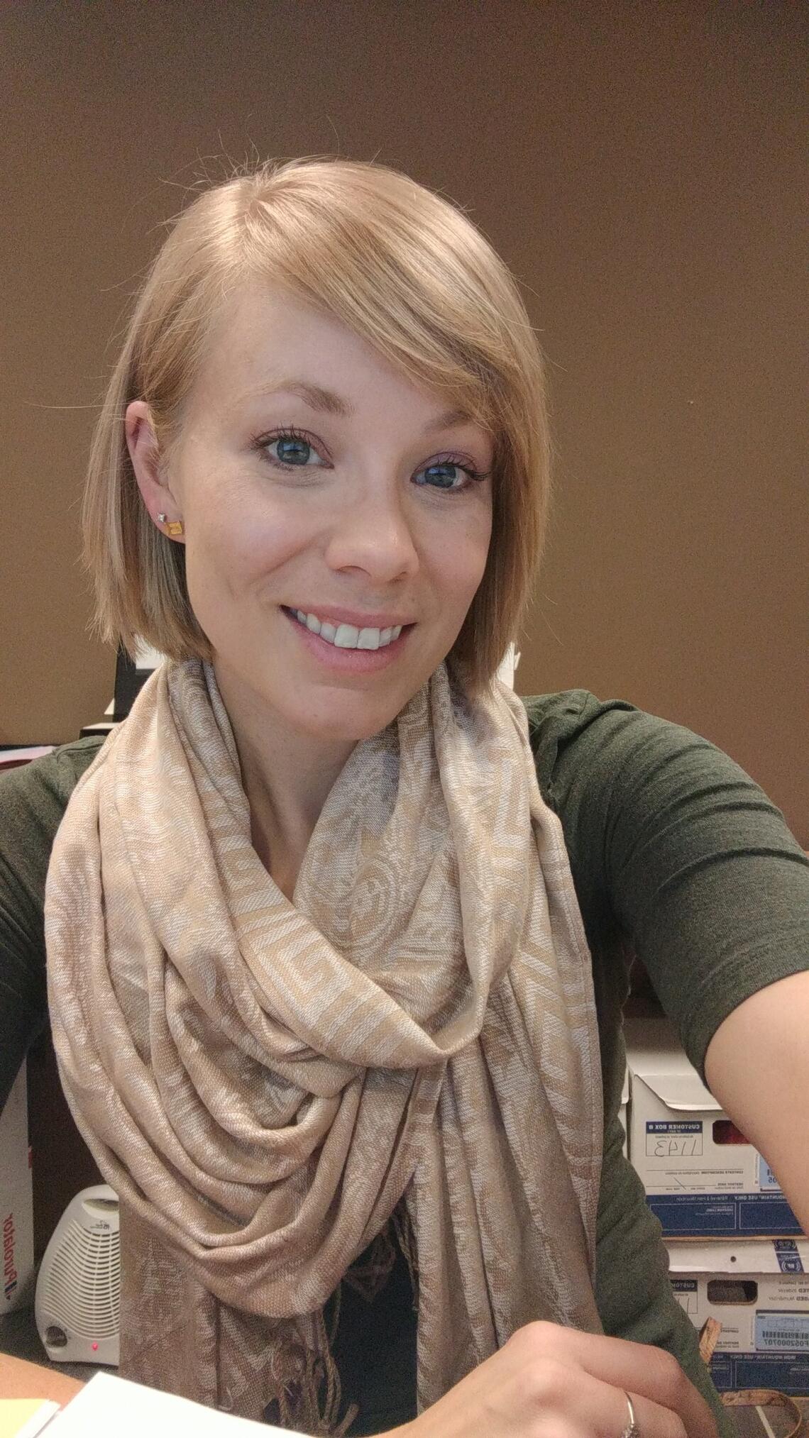 selfie of a woman wearting a t-shirt and scarf