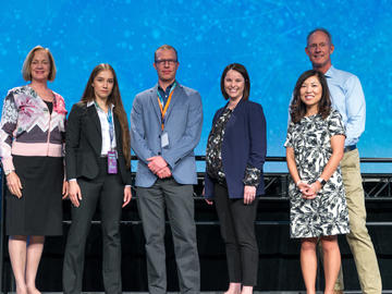 2nd Place - Creative Protein Solutions The team was presented with a $10,000 cheque at the 2019 TENET i2c competition finals. From left: Dr. Brenda Kenny, Daria Venkova and Jeroen De Buck, Sandra Stabel, Elisa Park, and Ken Moore.
