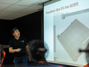 3D printing workshop instructor giving a presentation