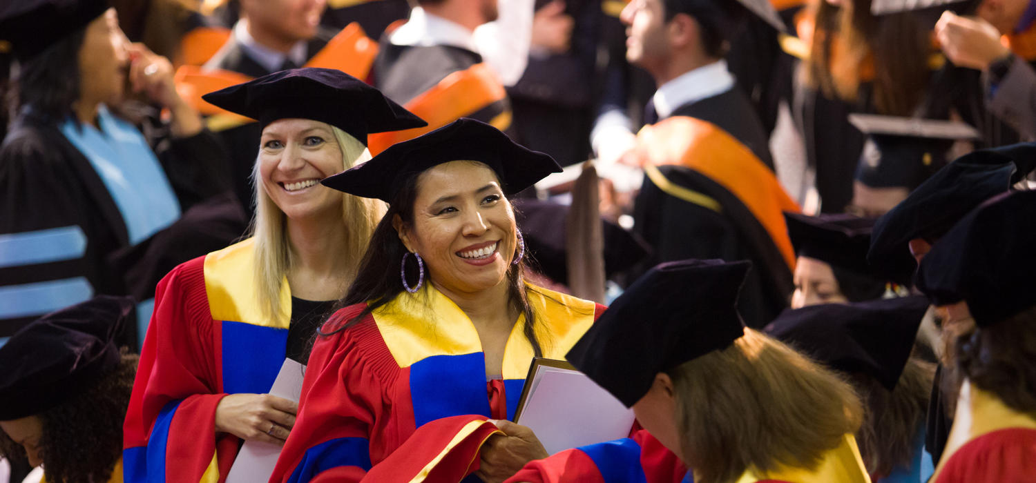 Doctoral degree grads, wearing their symbolic multi-coloured convocation gowns, take part in ceremonies this spring at the University of Calgary.