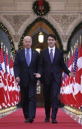 Prime Minister Justin Trudeau and Joe Biden, U.S. vice president at the time, walk down the Hall of Honour on Parliament Hill in Ottawa in December 2016. THE CANADIAN PRESS/Patrick Doyle