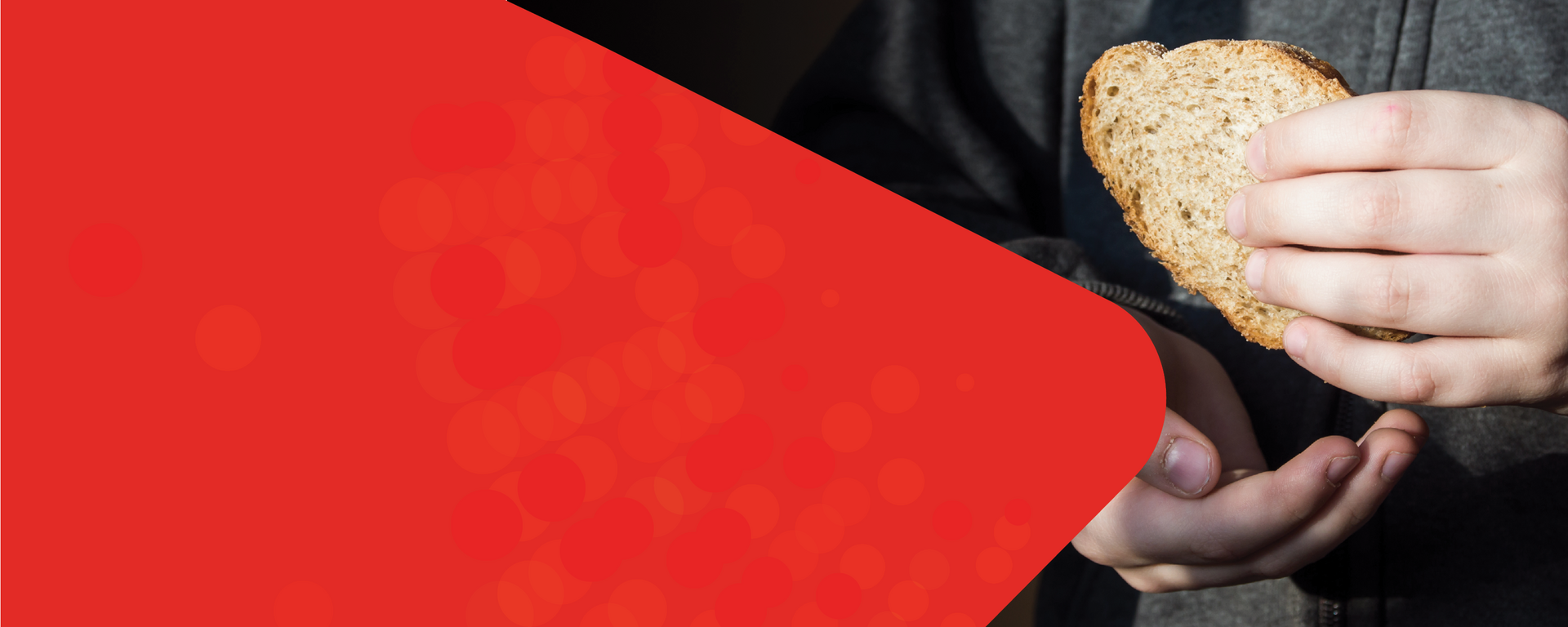 A banner with a person holding a piece of bread.