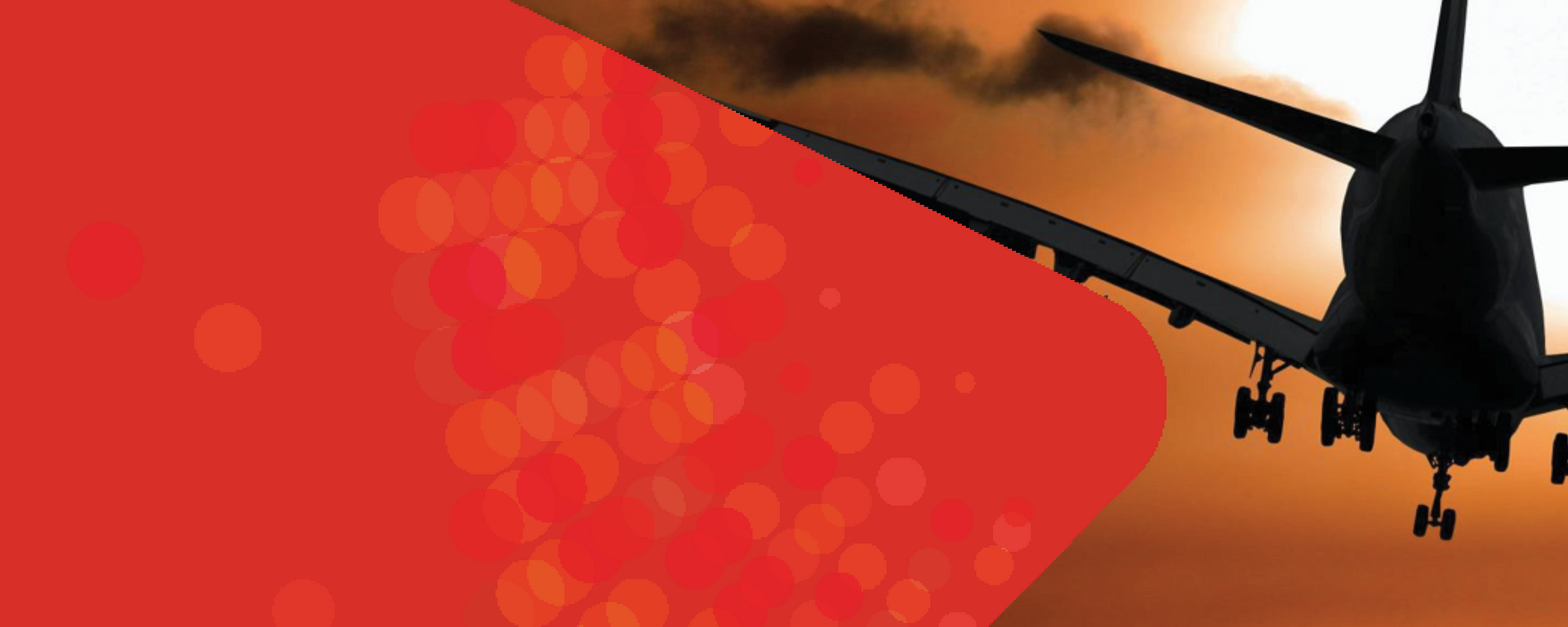 A plane flying in the sunset.