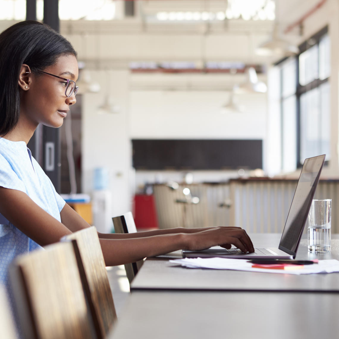 A woman working on a laptop