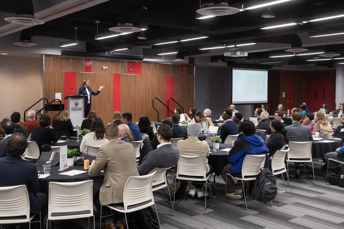 speaker at a pulpit addressing audience at last year's Grow Your Career Conference.