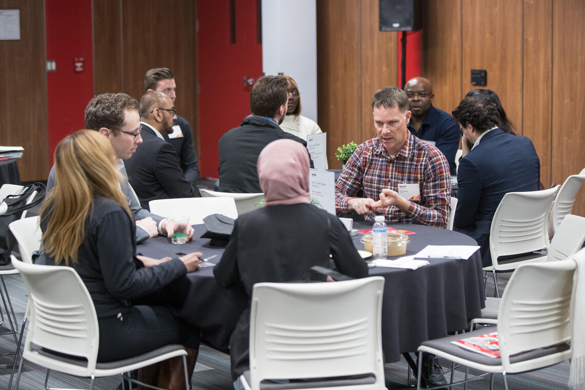 table full of people talking at last year's Grow Your Career Conference.