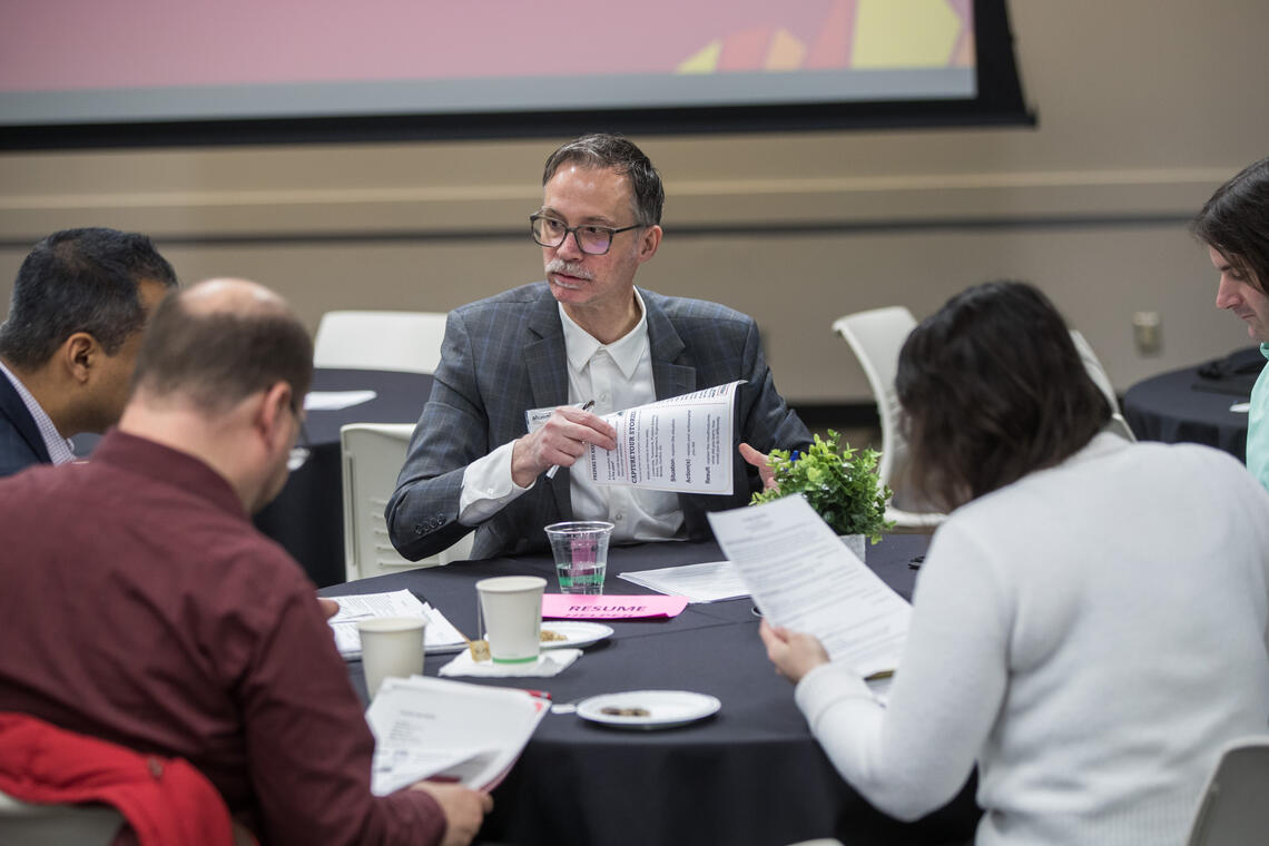 a table full of people exploring how to build a flexible "career framework"