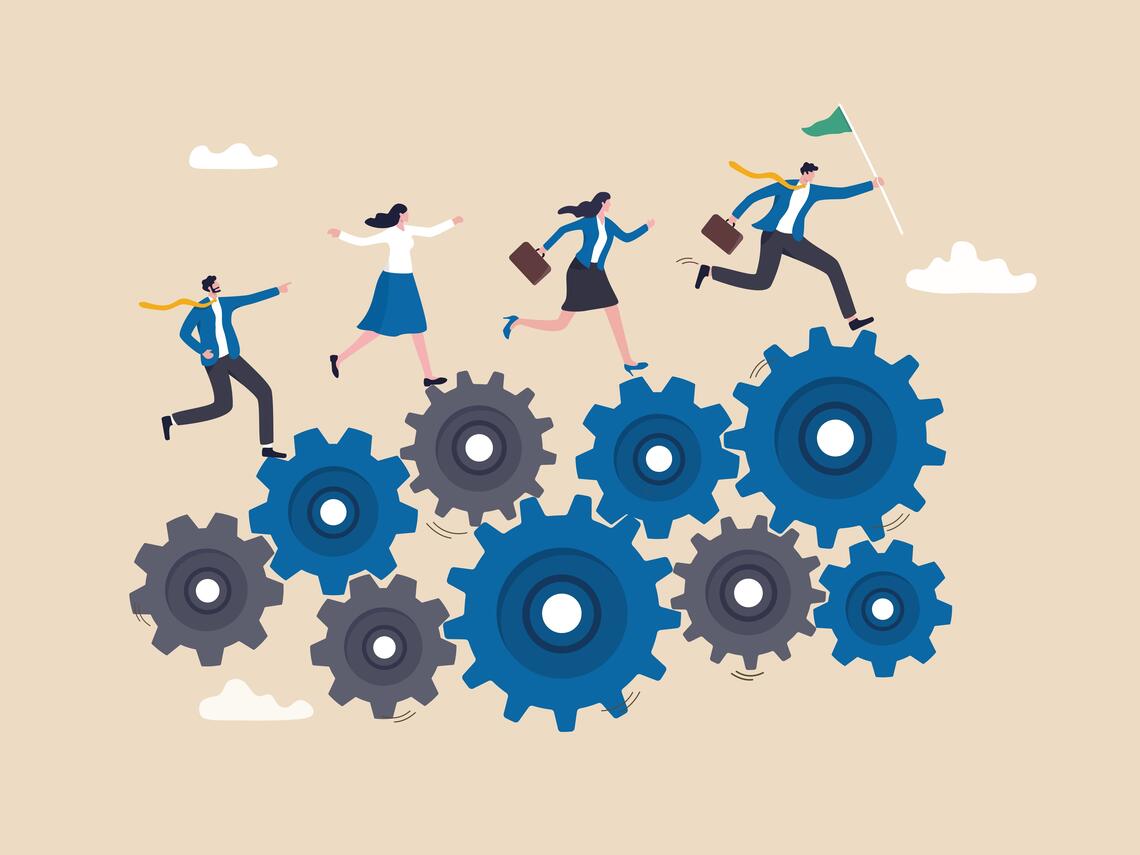 Business team climbing a hierarchy of interconnected blue and grey gears toward a green flag representing achievement.