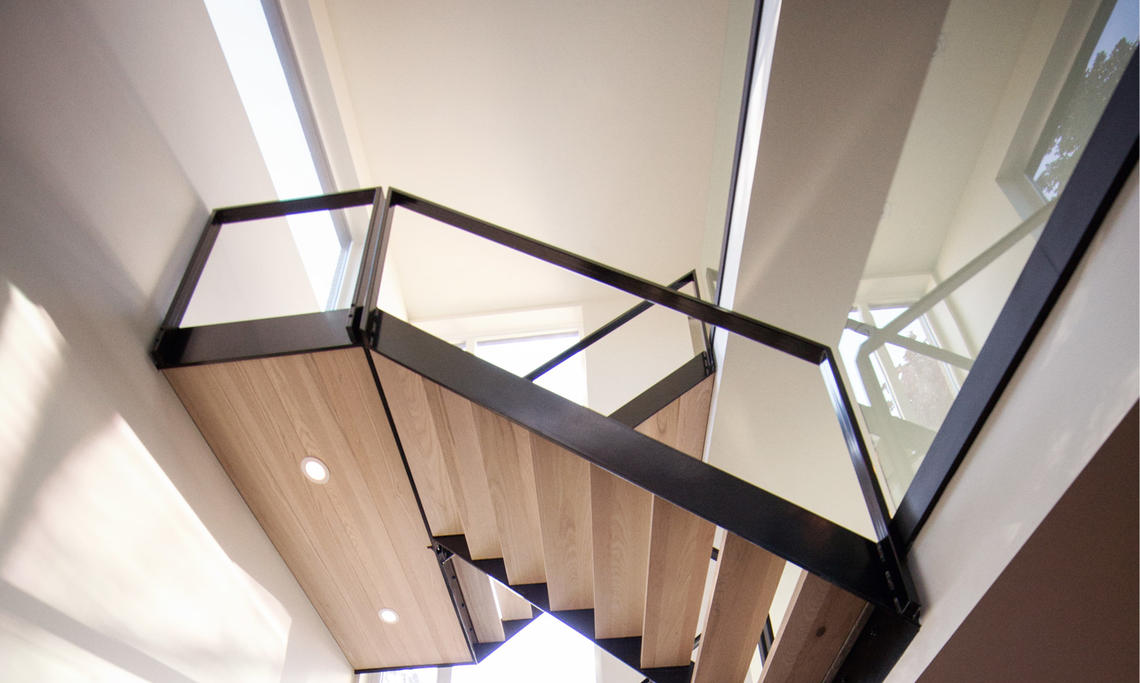 A light-filled stairwell in a Bioi Design + Build home in northeast Calgary.