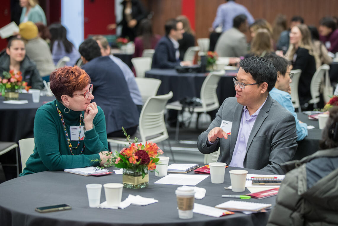 A man and woman sit across from each other speaking at last year's Grow Your Career Conference.