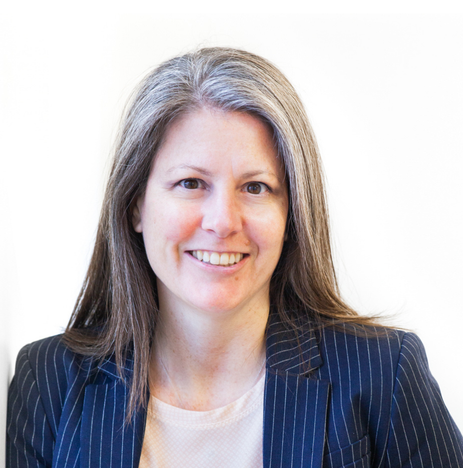 A photo of Jane wearing a blue pinstripe blazer over a white shirt. 