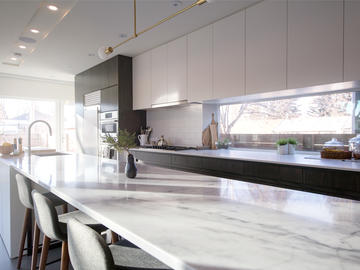 The kitchen-dining space features a 22-foot-long island.