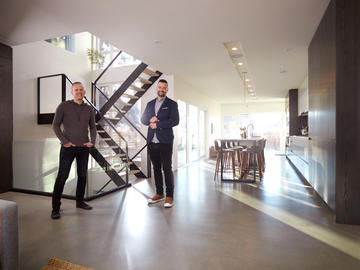 Bioi Design + Build’s Trefz, left, and Allen in the kitchen-dining space of a Winston Heights-Mountview home they recently completed.