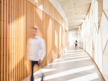 Seating nooks are tucked into this stroller-friendly hallway on the fourth floor.