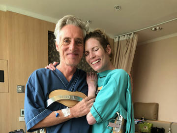 Russell reunites with fellow victim, Gerry Fox, one week after the crash. The pair received similar spinal fractures and matching braces.