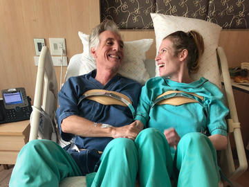 Russell reunites with fellow victim, Gerry Fox, one week after the crash. The pair received similar spinal fractures and matching braces.