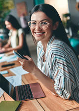 Smiling woman at in a co-working space