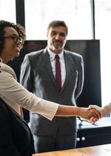 Young professionals shake hands