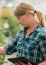 Woman working in a greenhouse