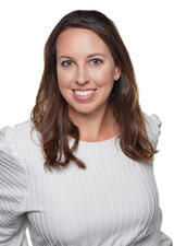 A professional photograph of Paula Worthington wearing a white blouse 