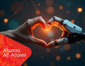 A human and robot hand making the shape of a heart against a dark background.
