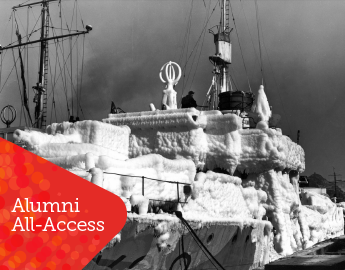 A large ship covered in ice, in black and white.