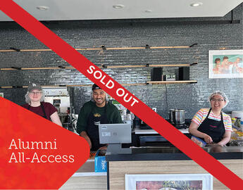 Three chefs in a kitchen with a red "sold out" banner across it.